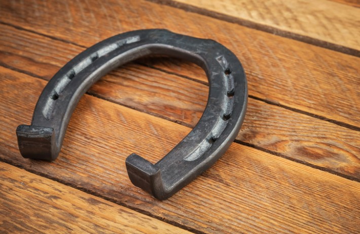 A modern horseshoe. It is made of steel and aluminium and it has a toe clip.