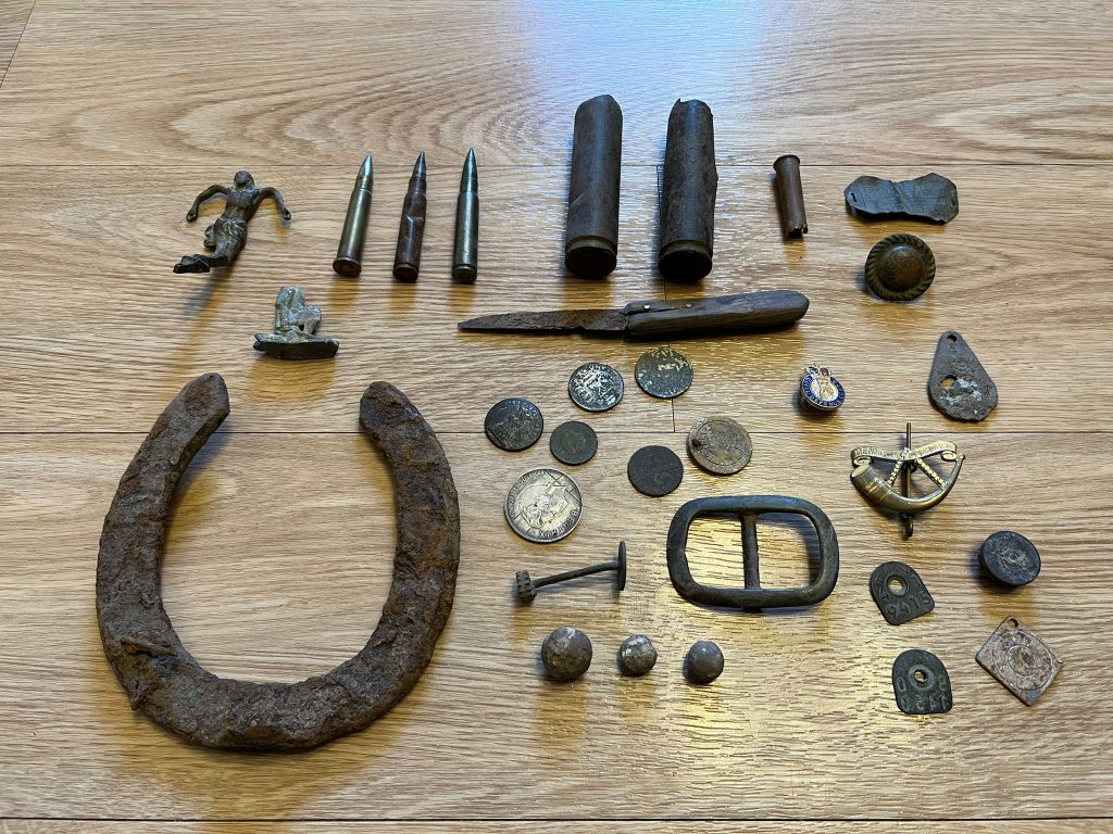 Metal detector finds like bullets, shrapnel, coins, buttons and horseshoes. 